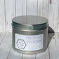 Hand-poured, nontoxic soy candle scented in Frosted Woods